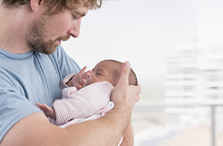 Daddy with a baby Daddy holds his baby