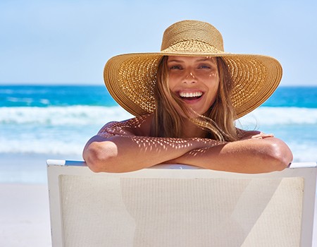 Young woman sunbathing on the beach